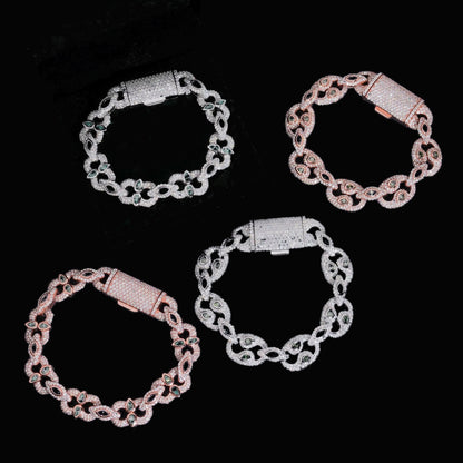 Bezel-Set Moissanite Cuban Link Bracelets in silver and rose gold displayed on black