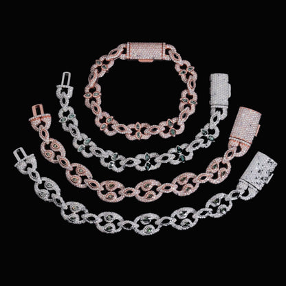 Bezel-Set Moissanite Cuban Link Bracelet in silver and rose gold on a black background