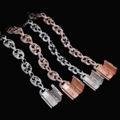 Open clasp detail of Bezel-Set Moissanite Cuban Link Bracelets in silver and rose gold