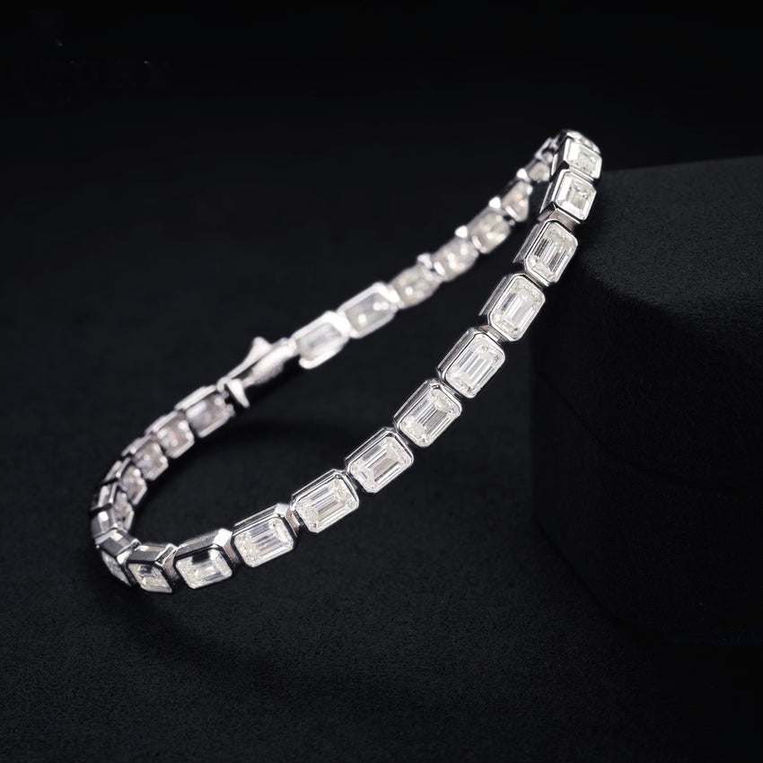 Emerald-cut 5mm moissanite tennis bracelet in Silver on a black noir background