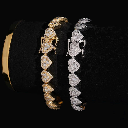 Infinity heart moissanite bracelets in silver and gold on a black background