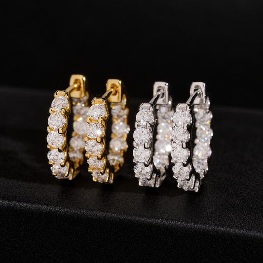 Radiant moissanite hoop earrings in gold and silver on a black background