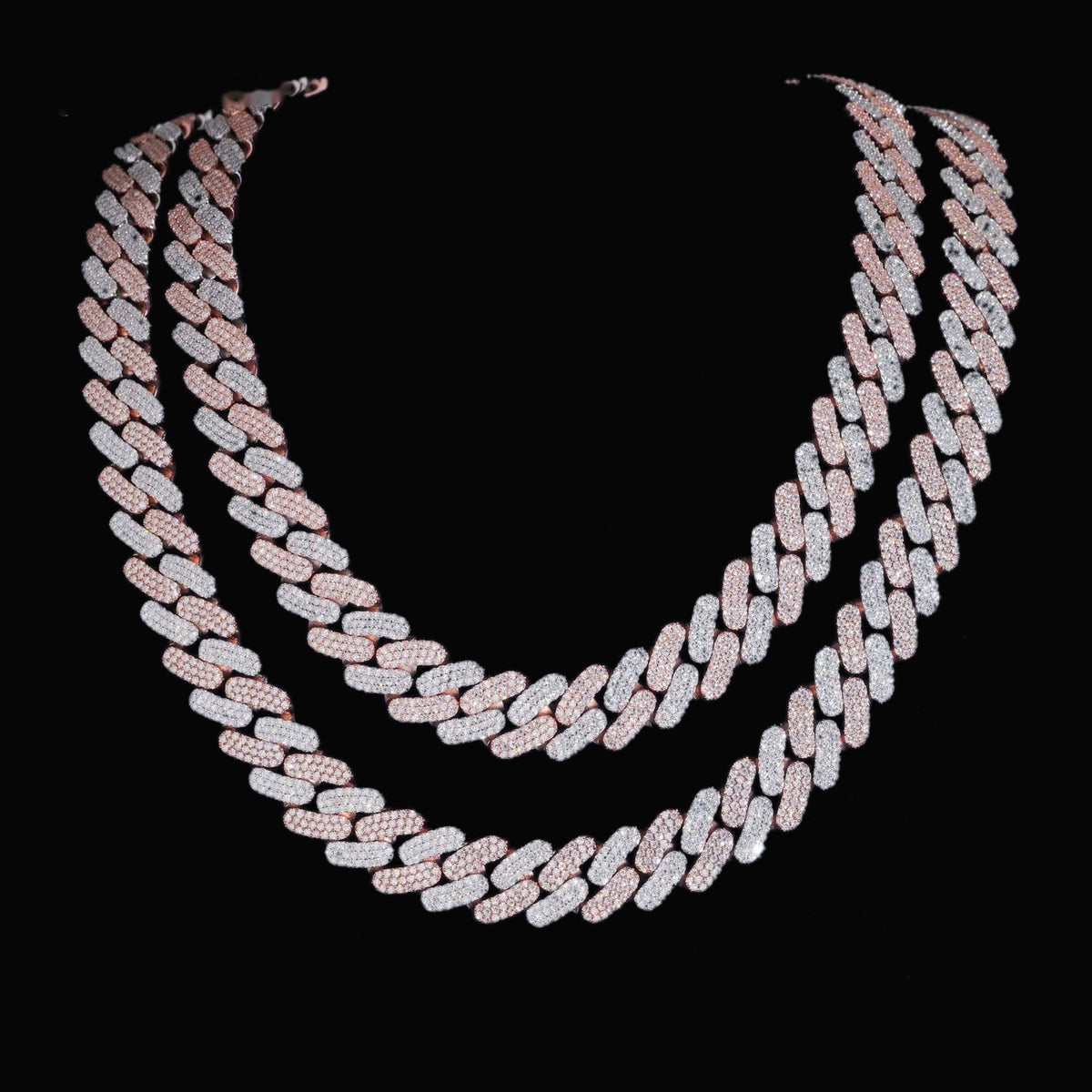Tri-row 16mm moissanite Cuban link chain in two-tone finish on a black display