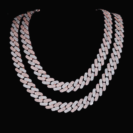 Tri-row 16mm moissanite Cuban link chain in two-tone finish on a black display