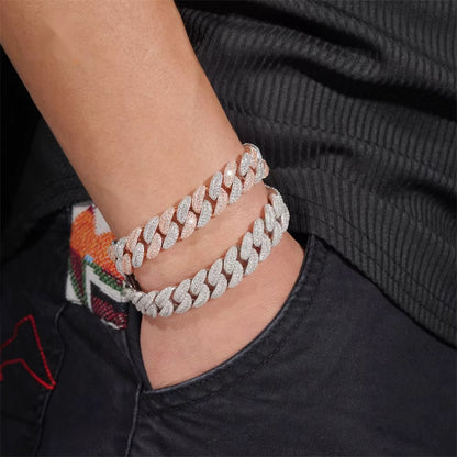Two-tone 13mm moissanite Cuban link bracelet worn on wrist